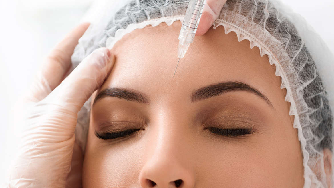 Woman under going a botox cosmetic treatment.